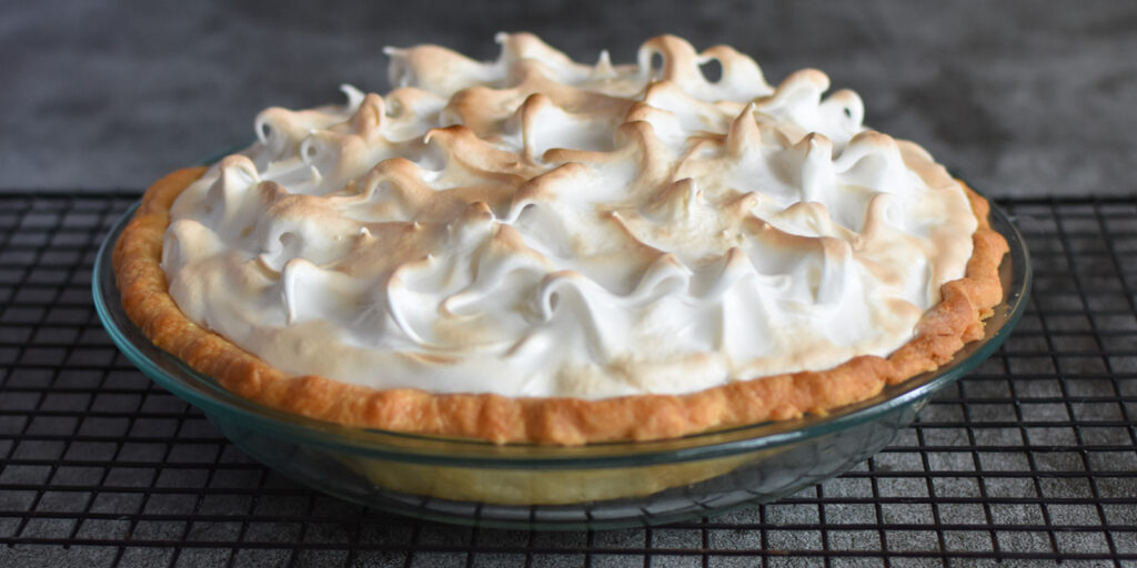 Butterscotch Meringue Pie on a cooling rack.