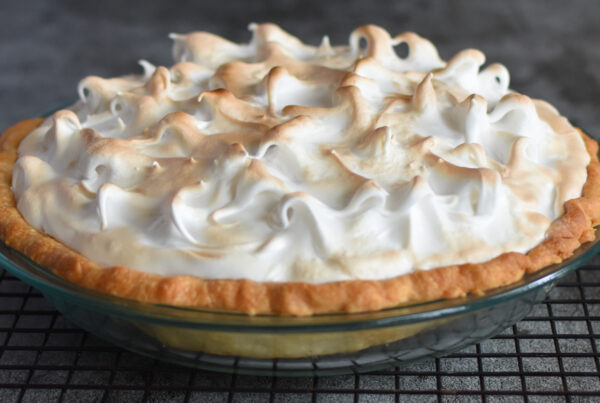 Butterscotch Meringue Pie on a cooling rack.