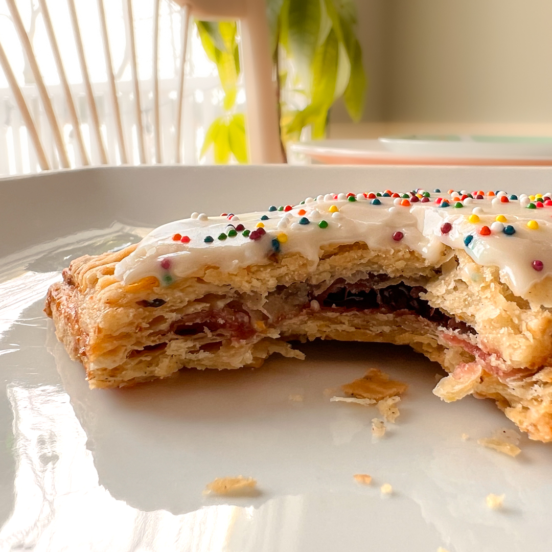 Strawberry-Cherry Pistachio Pop Tart on a white plate.