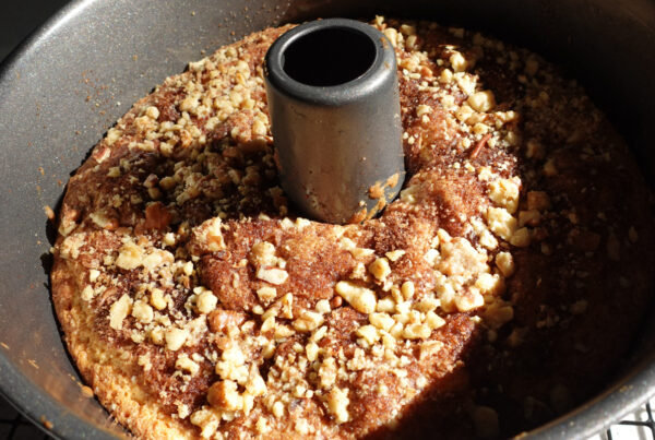Sour Cream Coffee Cake with Crumble Topping in a 10" tube pan fresh from the oven.