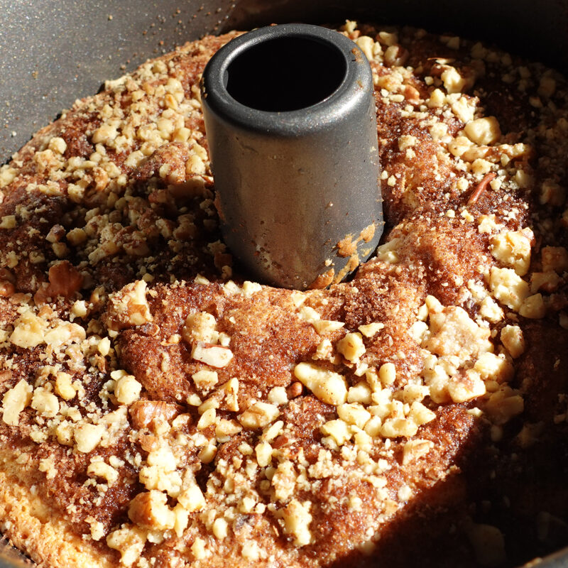 Sour Cream Coffee Cake with Crumble Topping in a 10" tube pan fresh from the oven.