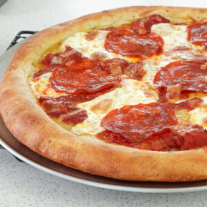 Pizza fresh from oven, with a thick crust.