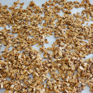 Simple Flaxseed Granola on a white parchment paper.