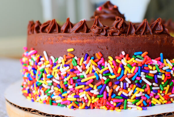 Up close shot of a cake on a white surface.