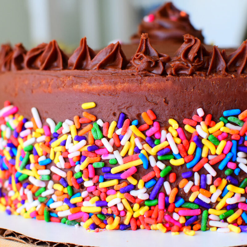 Up close shot of a cake on a white surface.