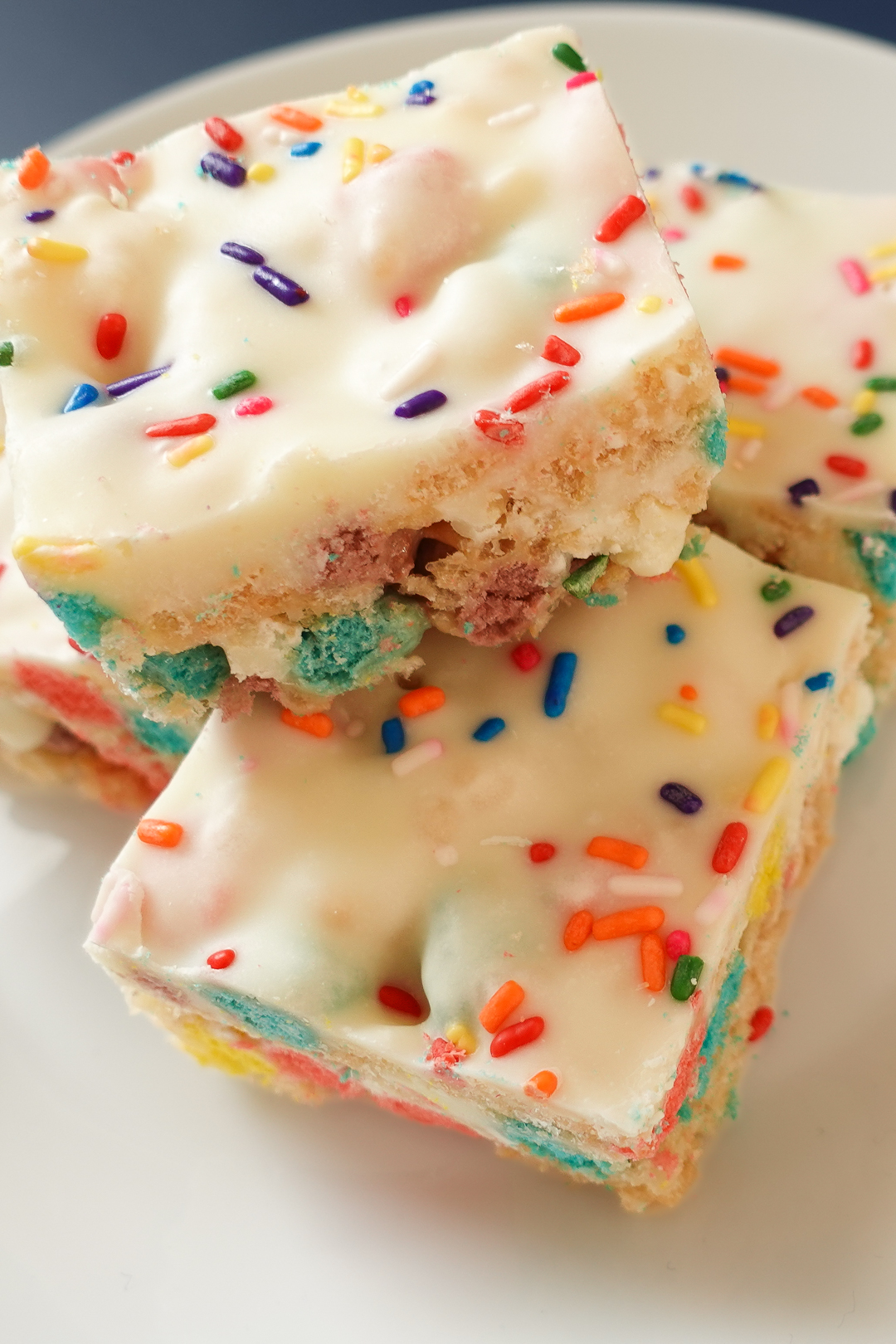 This is an up-close aerial image of the birthday bars on a white plate.