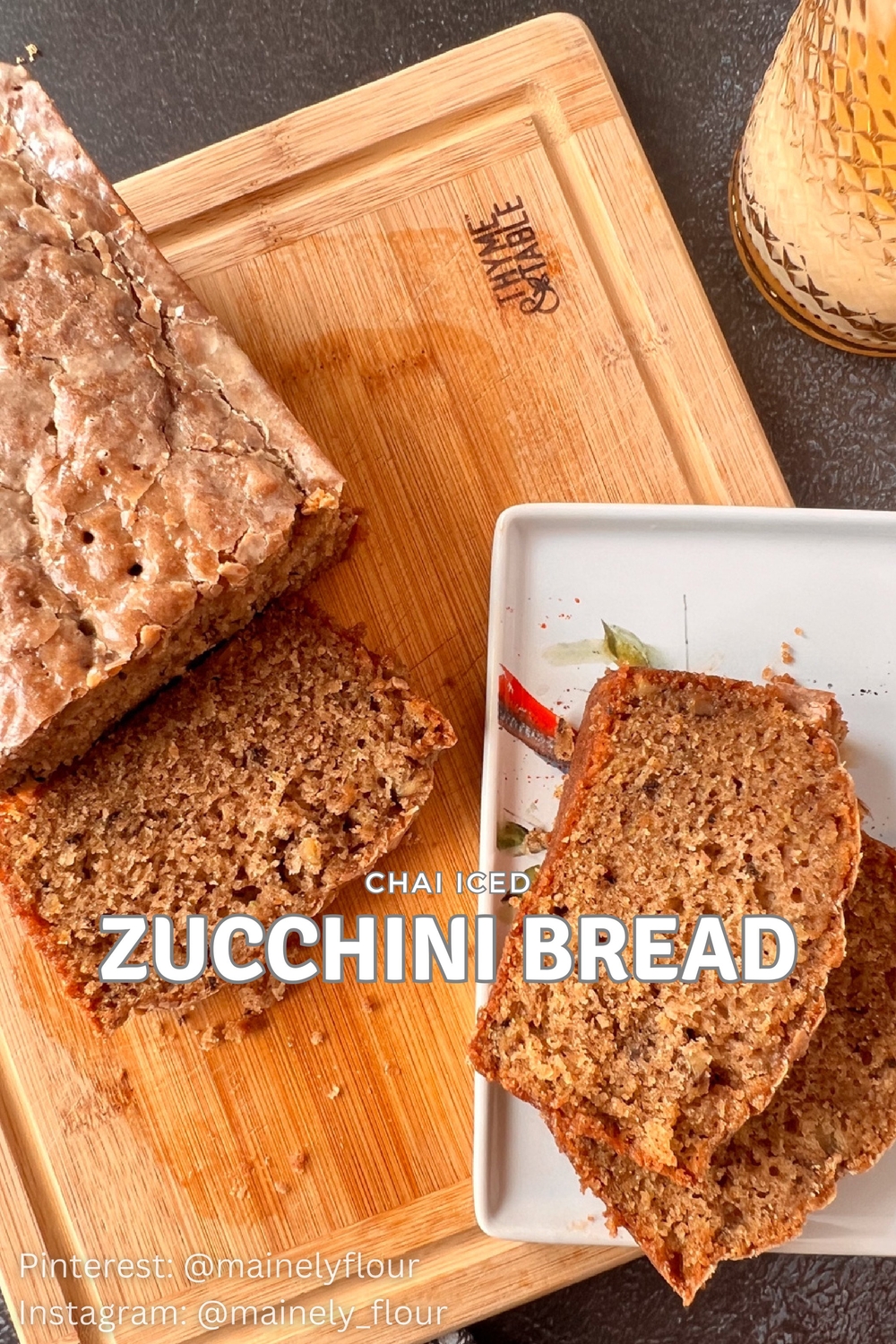 This is an image of zucchini bread on a cutting board with three slices nearby.