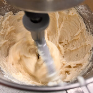 This image shows the frosting after the vanilla, heavy cream, and corn syrup has been added. It is now ready to be used.