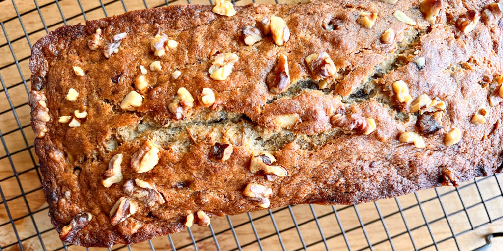 This is an image of vegan banana bread on a cooling rack.