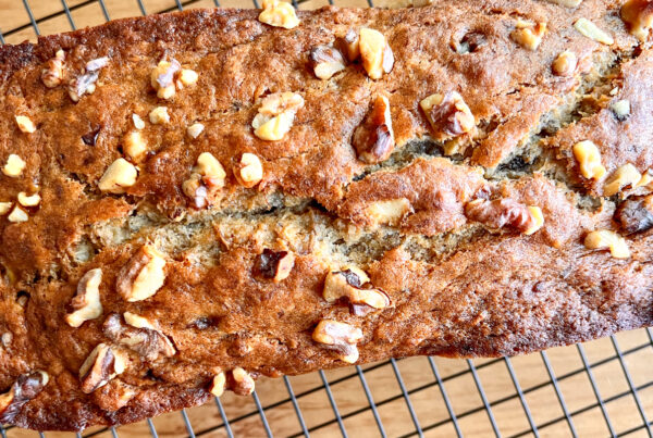This is an image of vegan banana bread on a cooling rack.
