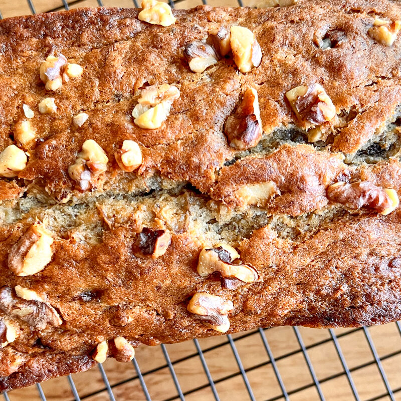 This is an image of vegan banana bread on a cooling rack.