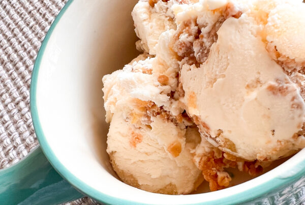 An image of scooped no-churn apple crisp ice cream in a bowl with a handle.