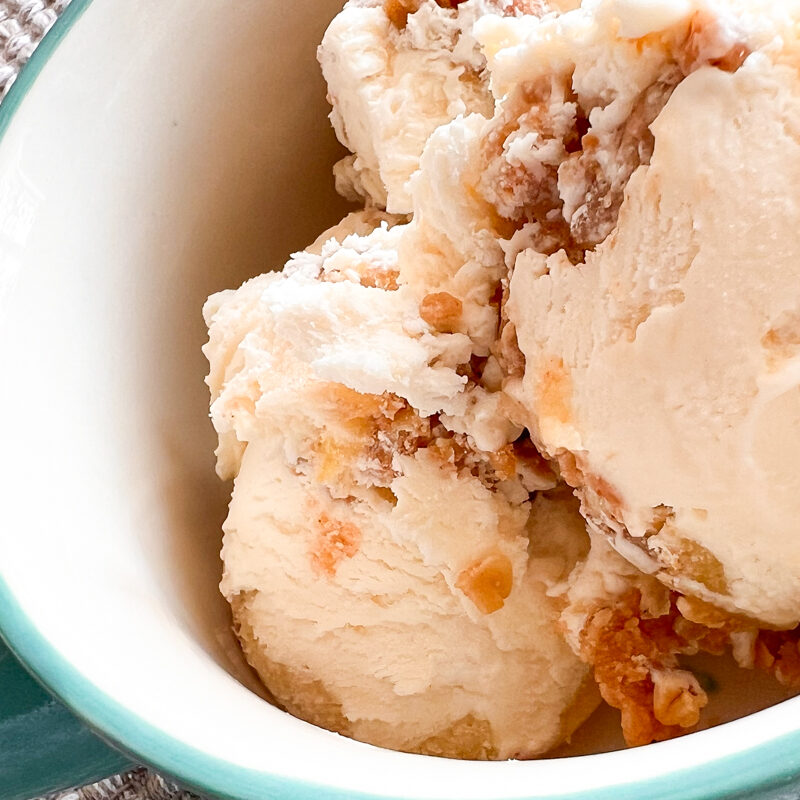 An image of scooped no-churn apple crisp ice cream in a bowl with a handle.