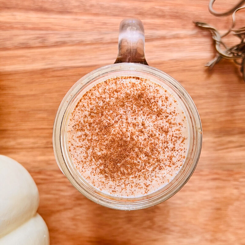 This is a top-down view of pumpkin cold foam on top of cold brew coffee.