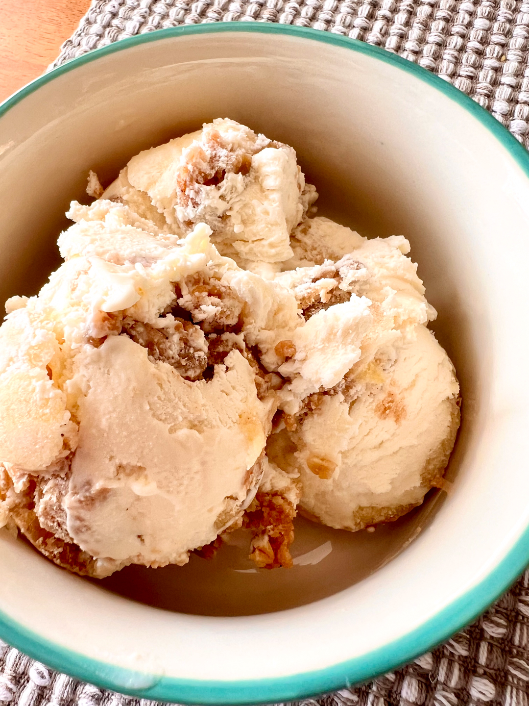 An aerial image of scooped no-churn apple crisp ice cream in a bowl.