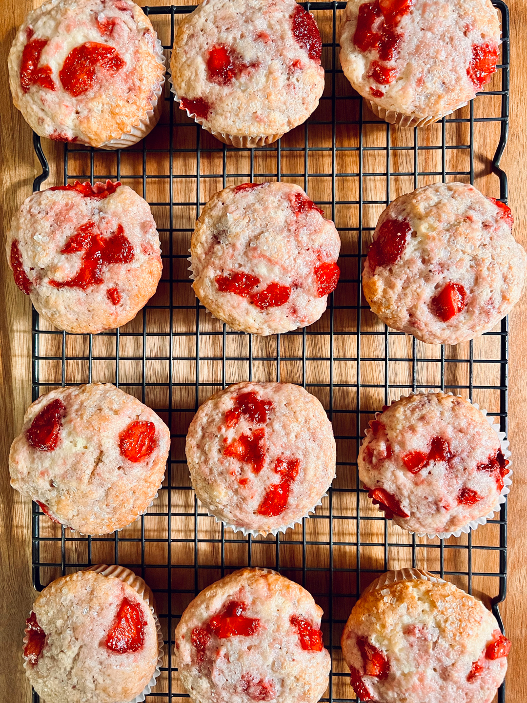 Top down view of muffins on a cooling rack.