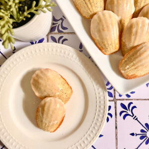 Two Madeleines on a white plate.