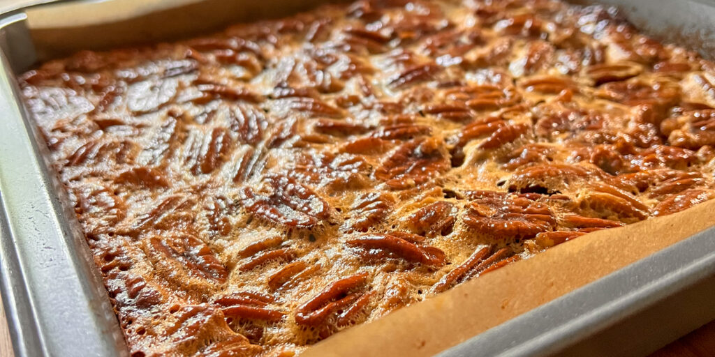 Closeup of Pecan Pie Bars still in the pan.