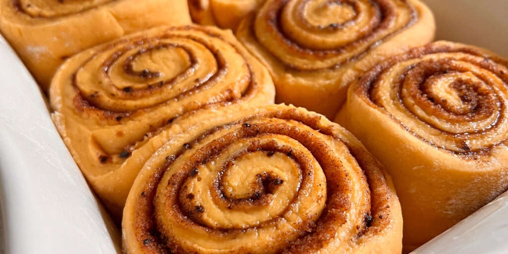 Closeup shot of pumpkin spice rolls without any icing on top.