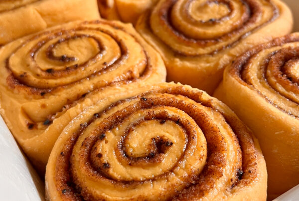 Closeup shot of pumpkin spice rolls without any icing on top.